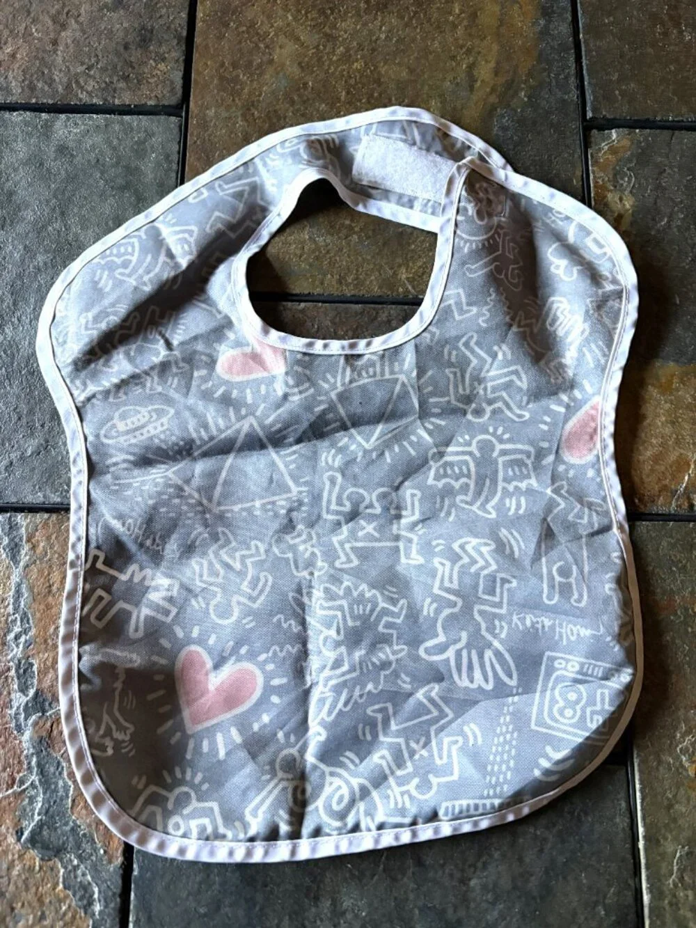 Keith Haring x Bumkins baby bib pop art black white red